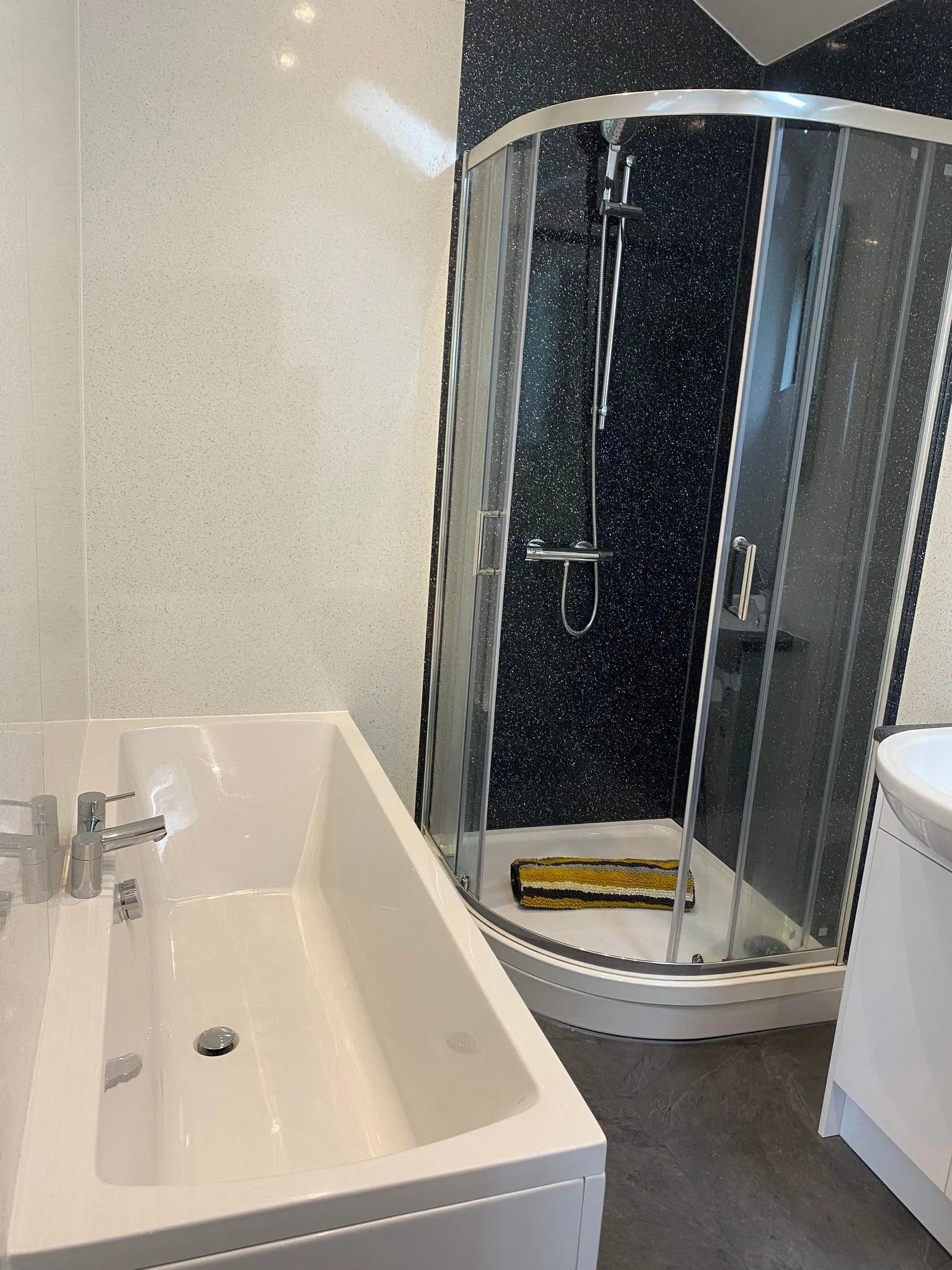 The bathroom with separate bath and shower