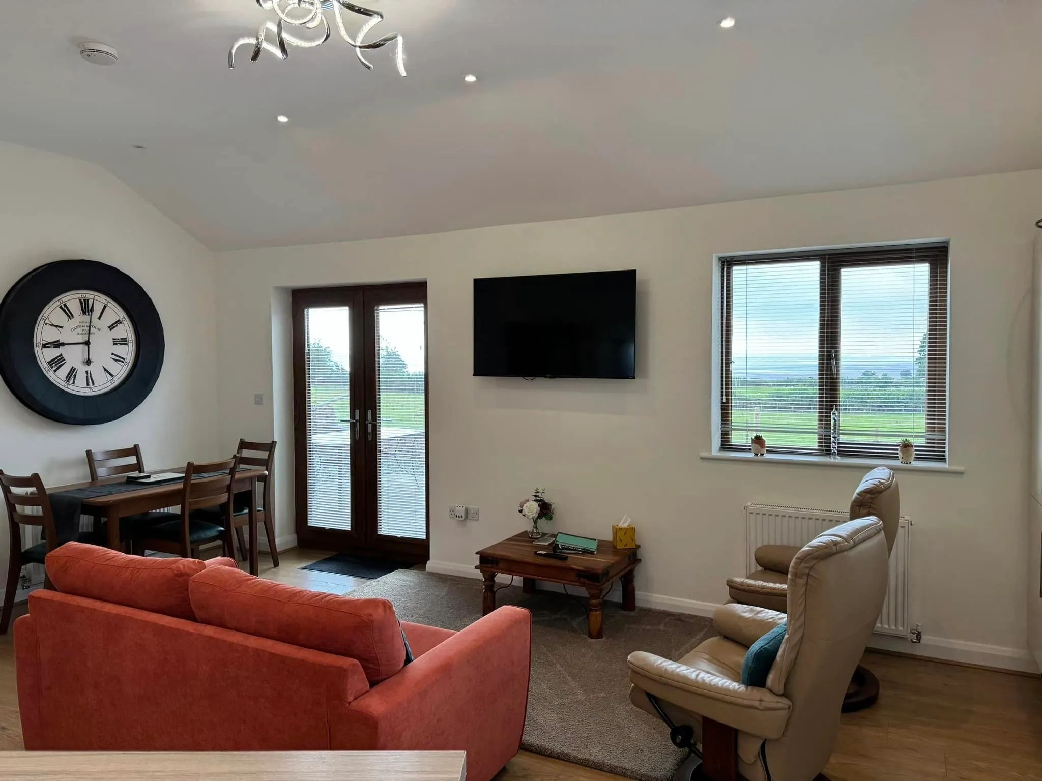 The bright open-plan lounge with views over Morecambe Bay
